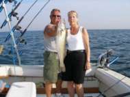 Captain Marv and client pose with a great walleye while fishing.