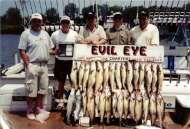 Five men pose with a great bounty of fish.