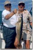 Two older gentleman show us a nice walleye.