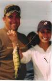 Smiling Couple poses with Perch.