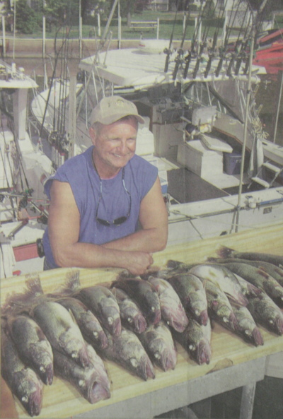 Lake Erie charter boat captain Marv DeGreen of Huntsburg Township holds a plump Central Basin walleye.